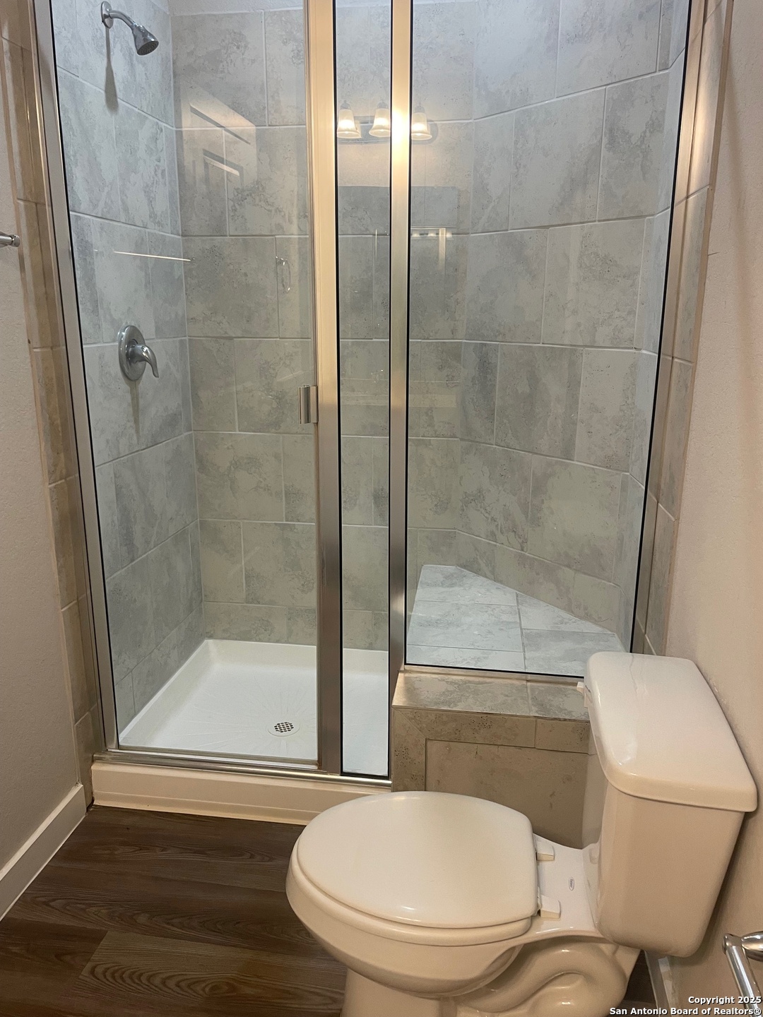 8318 Runner Cove, Unit 101 San Antonio, TX 78249 - Photo 11 of 36 a bathroom with a toilet and a shower