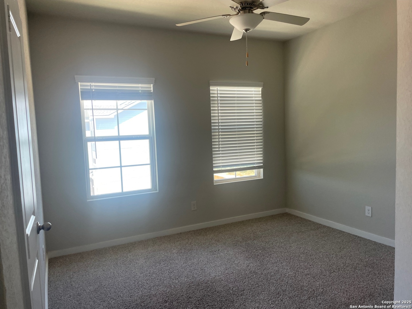 8318 Runner Cove, Unit 101 San Antonio, TX 78249 - Photo 14 of 36 an empty room with a window
