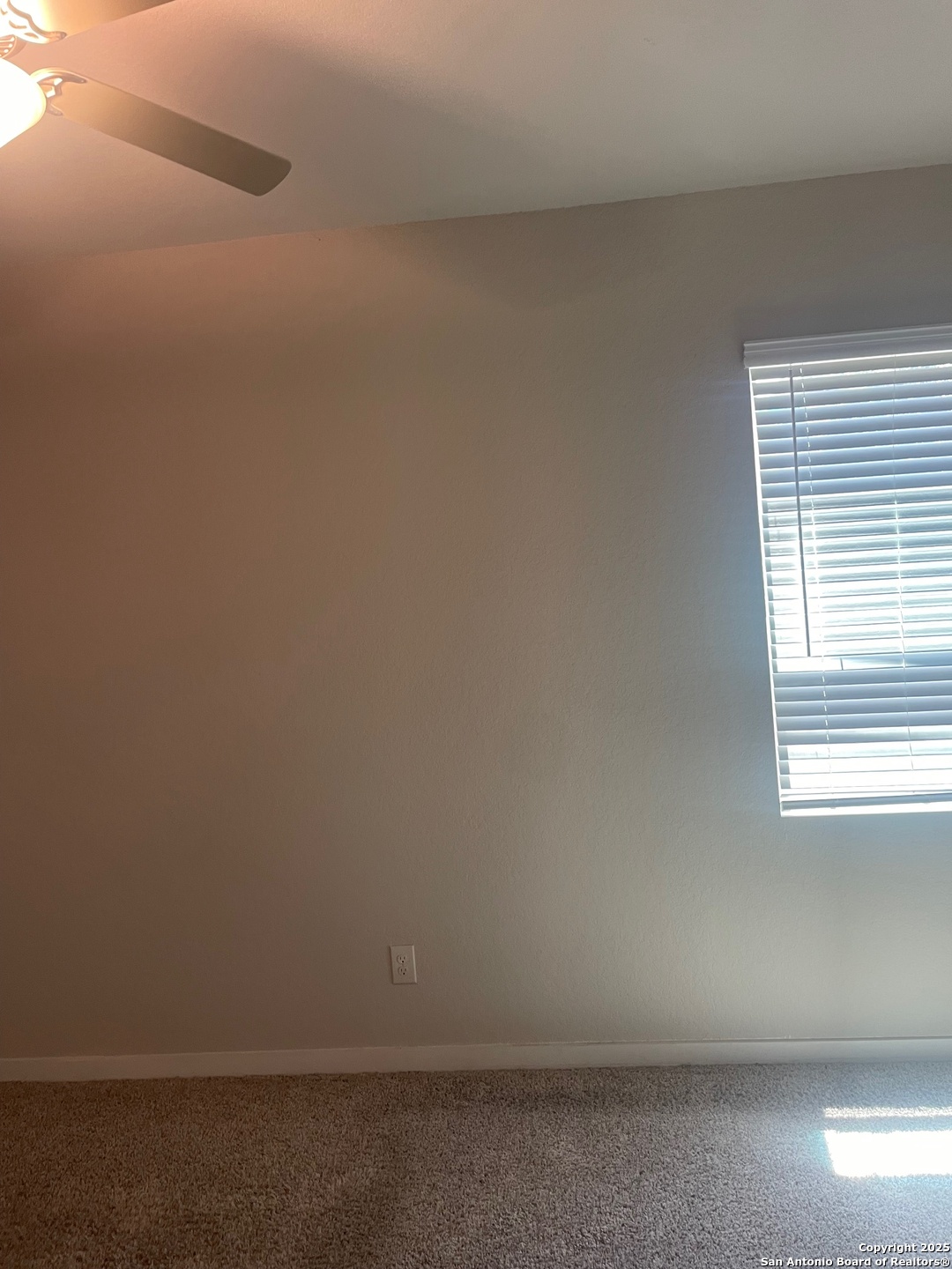 8318 Runner Cove, Unit 101 San Antonio, TX 78249 - Photo 23 of 36 a view of an empty room and window