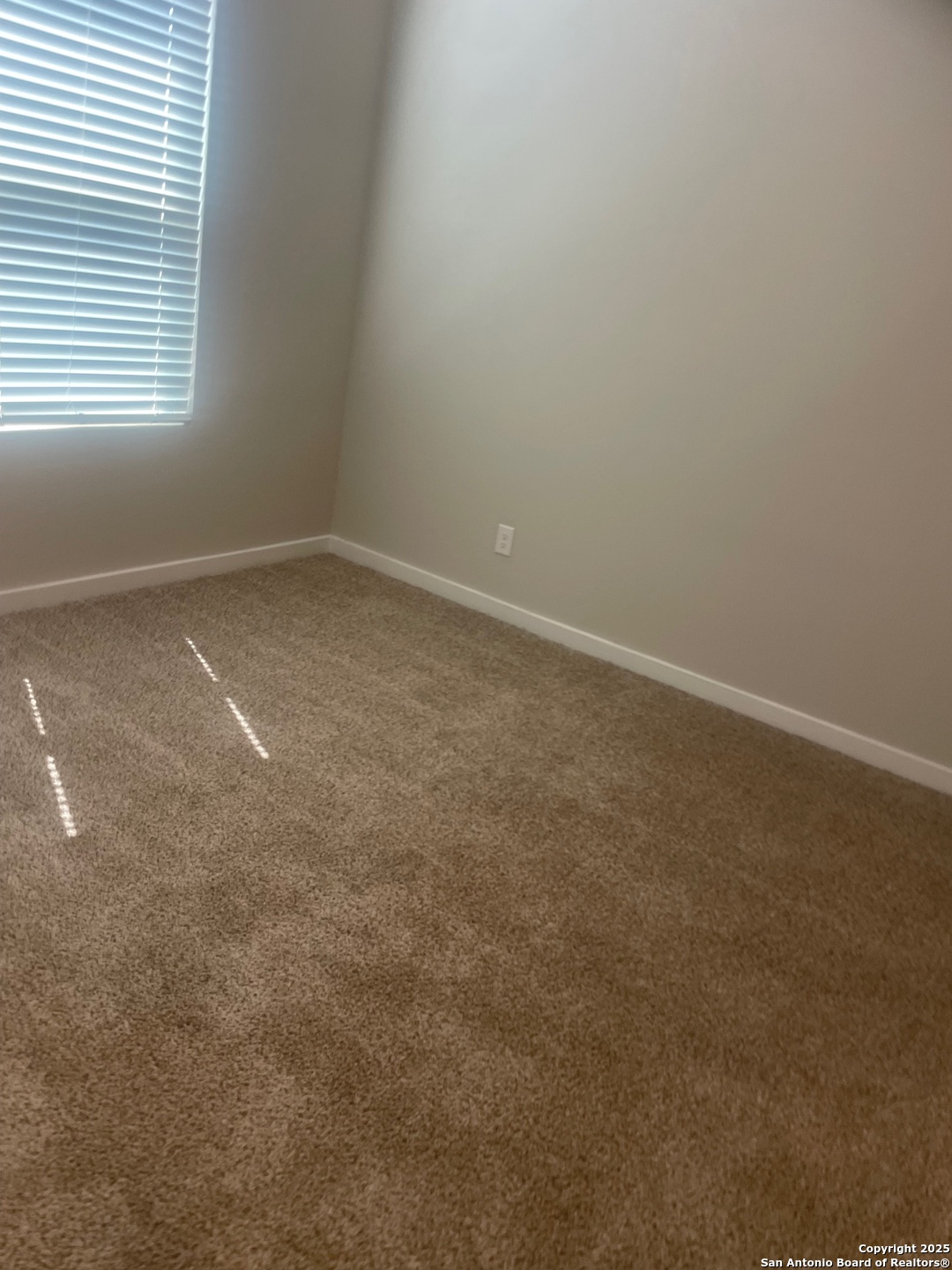 8318 Runner Cove, Unit 101 San Antonio, TX 78249 - Photo 29 of 36 an empty room with a window