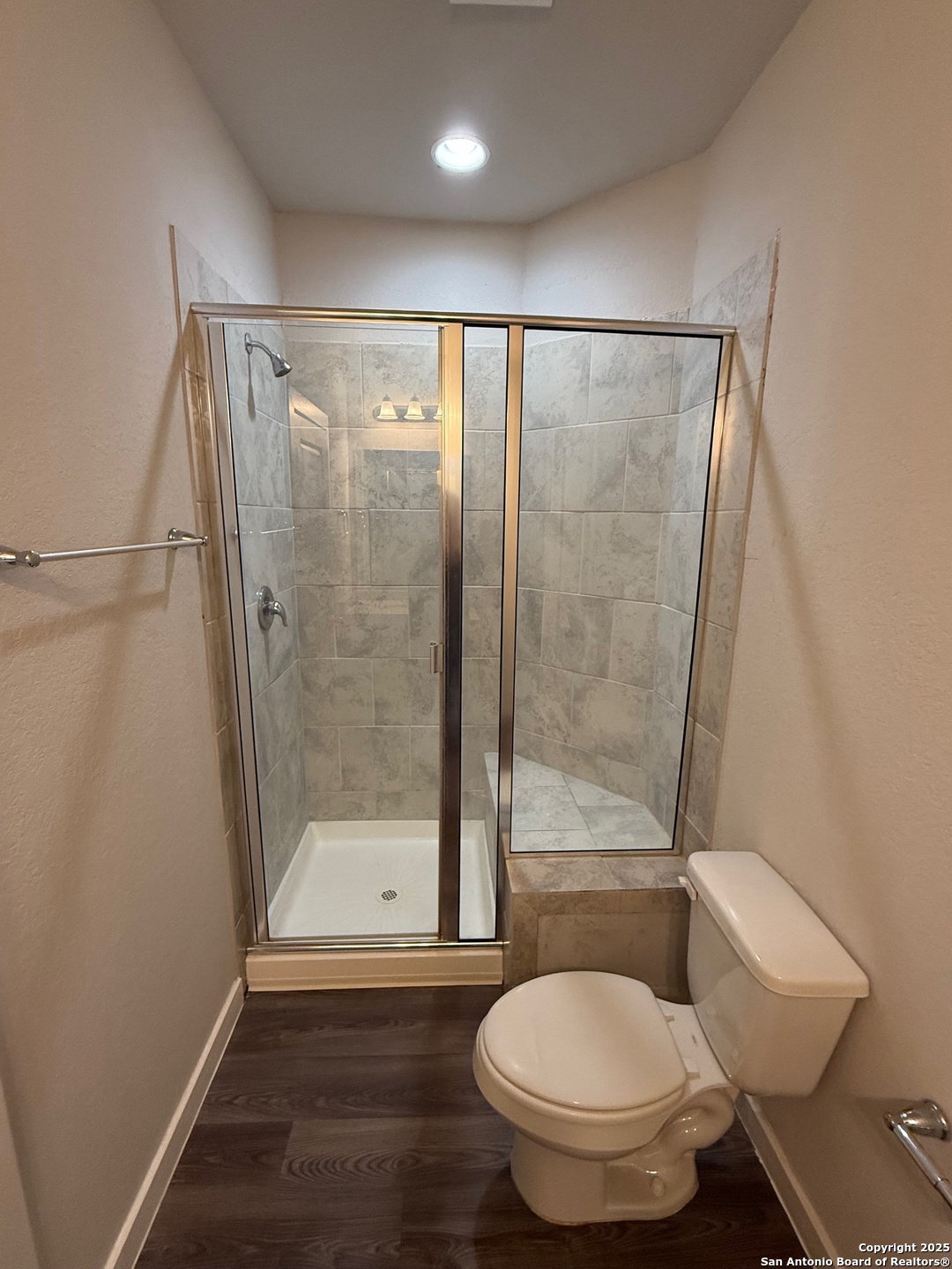 8318 Runner Cove, Unit 101 San Antonio, TX 78249 - Photo 8 of 36 a bathroom with a shower and a toilet