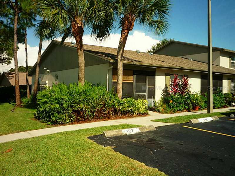 2131 Ridge Road South, Unit 127 Largo, FL 33778 - Photo 1 of 1 a front view of house with yard and green space