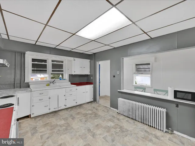 a large white room with a large window