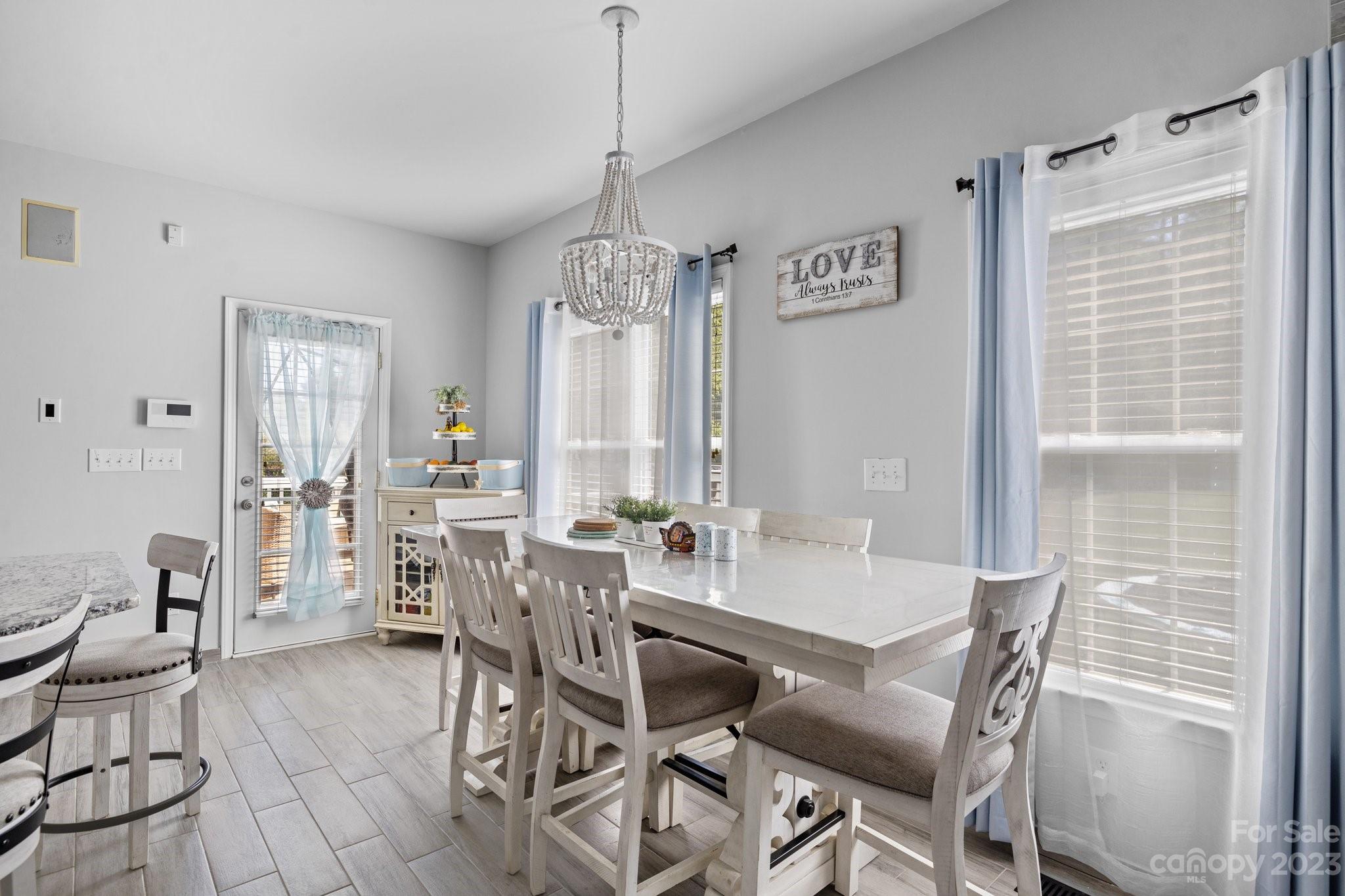 10834 Hellebore Road Charlotte, NC 28213 - Photo 11 of 41 a view of a dining room with furniture window and outside view