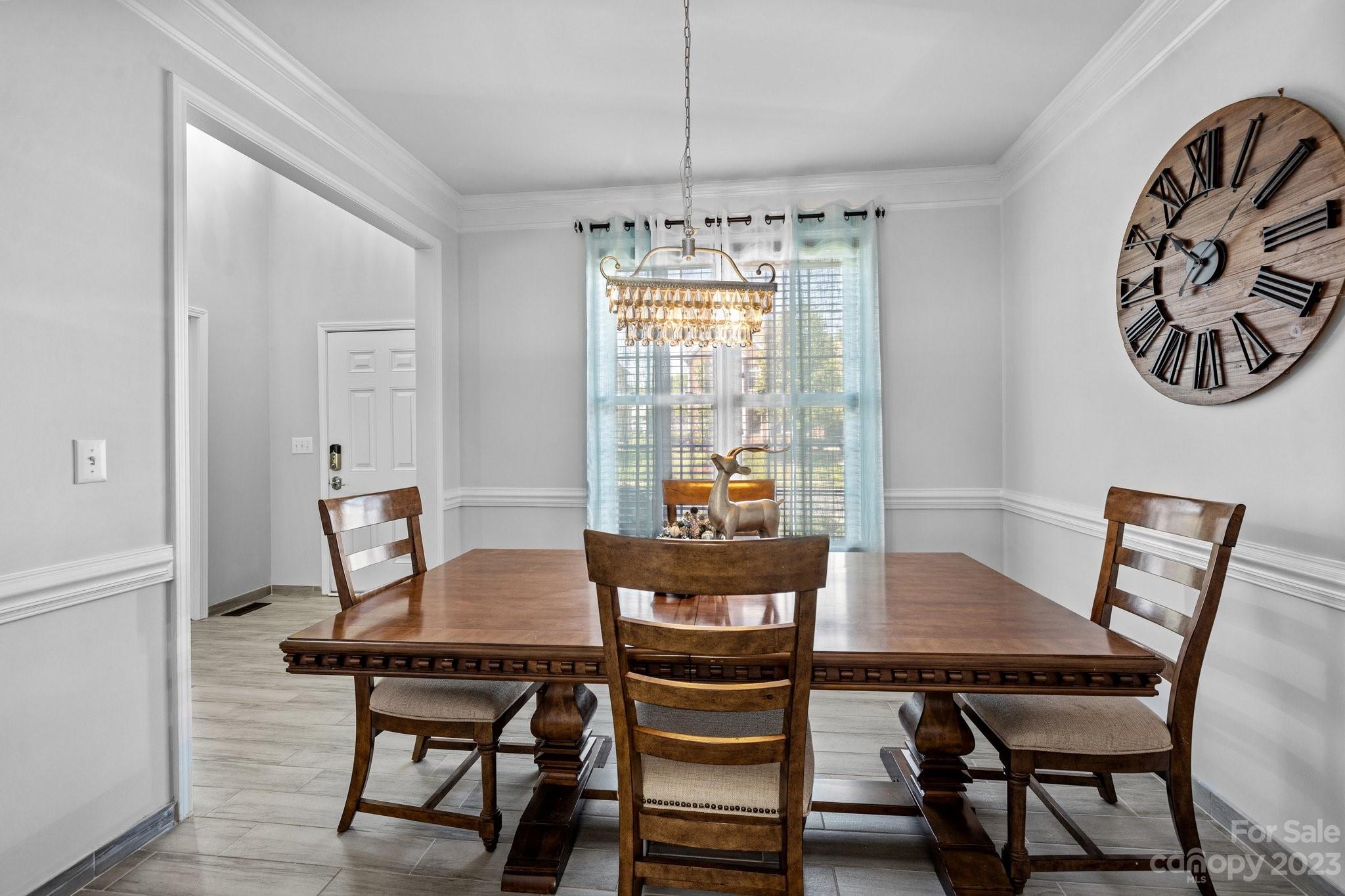 10834 Hellebore Road Charlotte, NC 28213 - Photo 14 of 41 a view of a dining room with furniture window and outside view