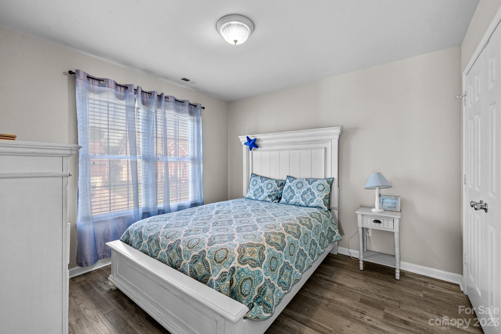 10834 Hellebore Road Charlotte, NC 28213 - Photo 18 of 41 a bedroom with a bed and a window