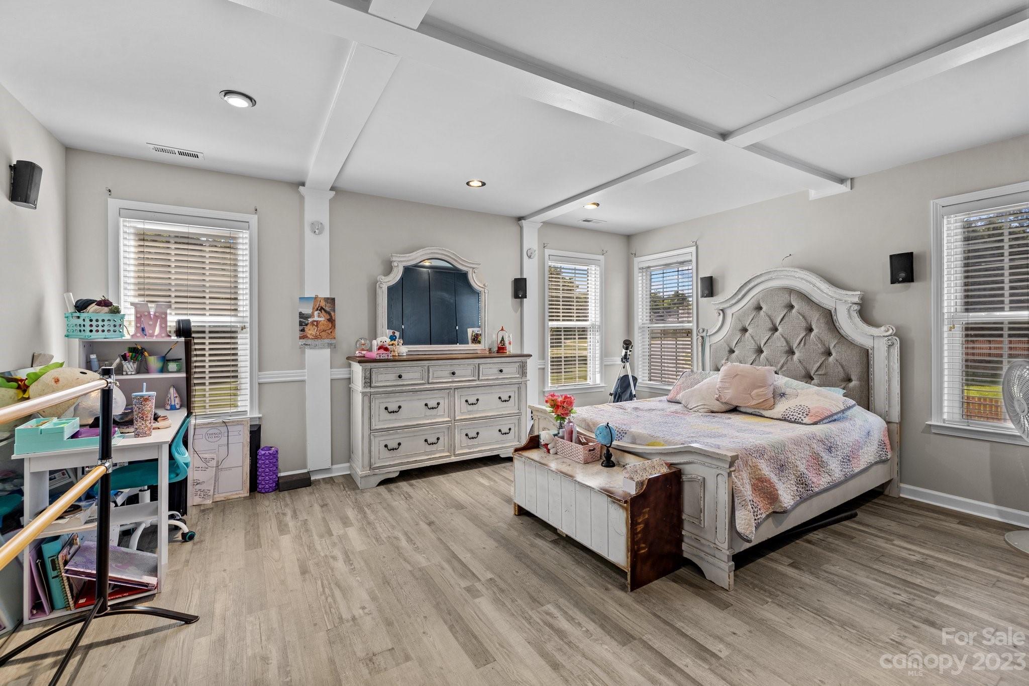 10834 Hellebore Road Charlotte, NC 28213 - Photo 21 of 41 a bedroom with a bed and furniture