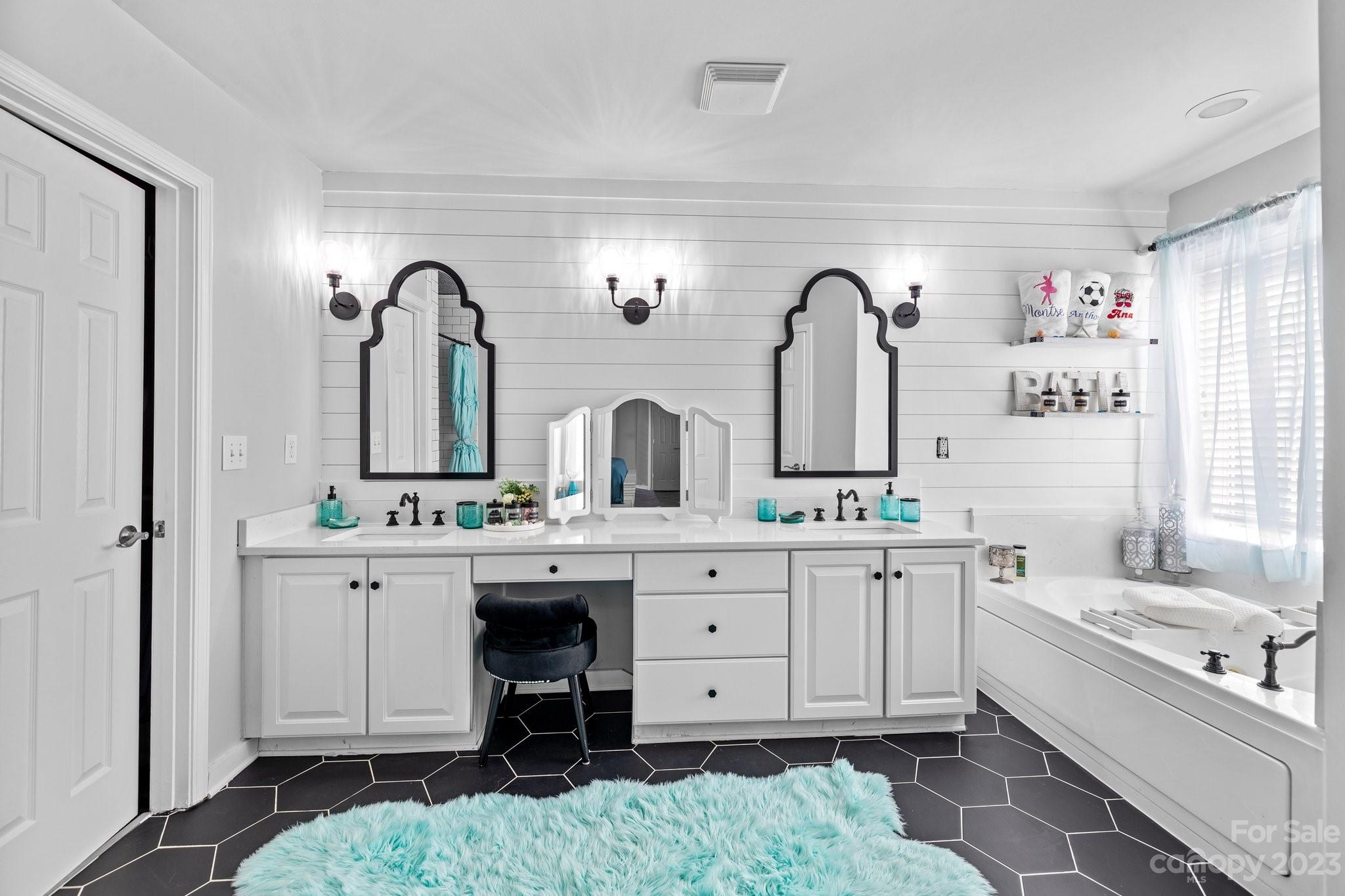 10834 Hellebore Road Charlotte, NC 28213 - Photo 27 of 41 a bathroom with a double vanity sink mirror and bathtub