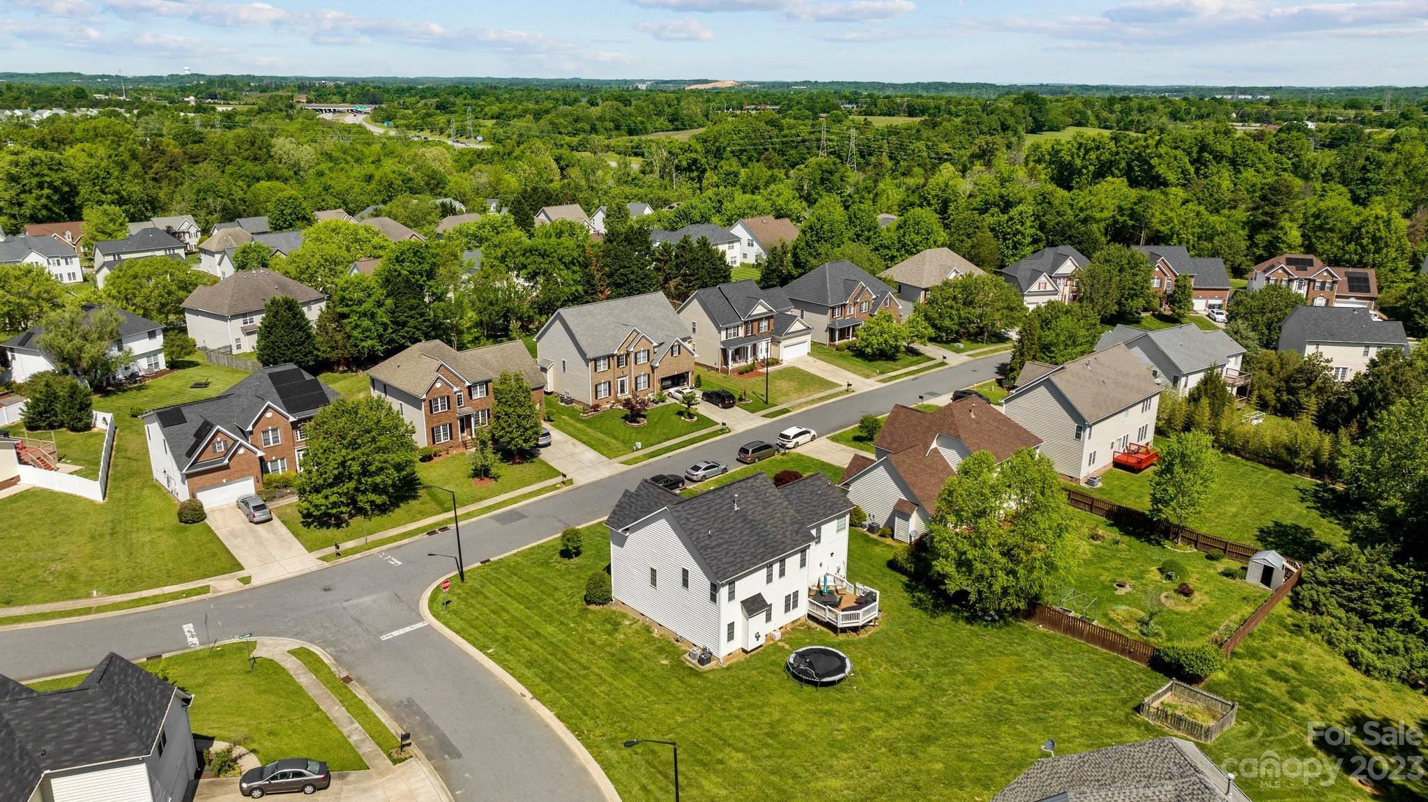 10834 Hellebore Road Charlotte, NC 28213 - Photo 38 of 41 an aerial view of a house with yard swimming pool and outdoor seating