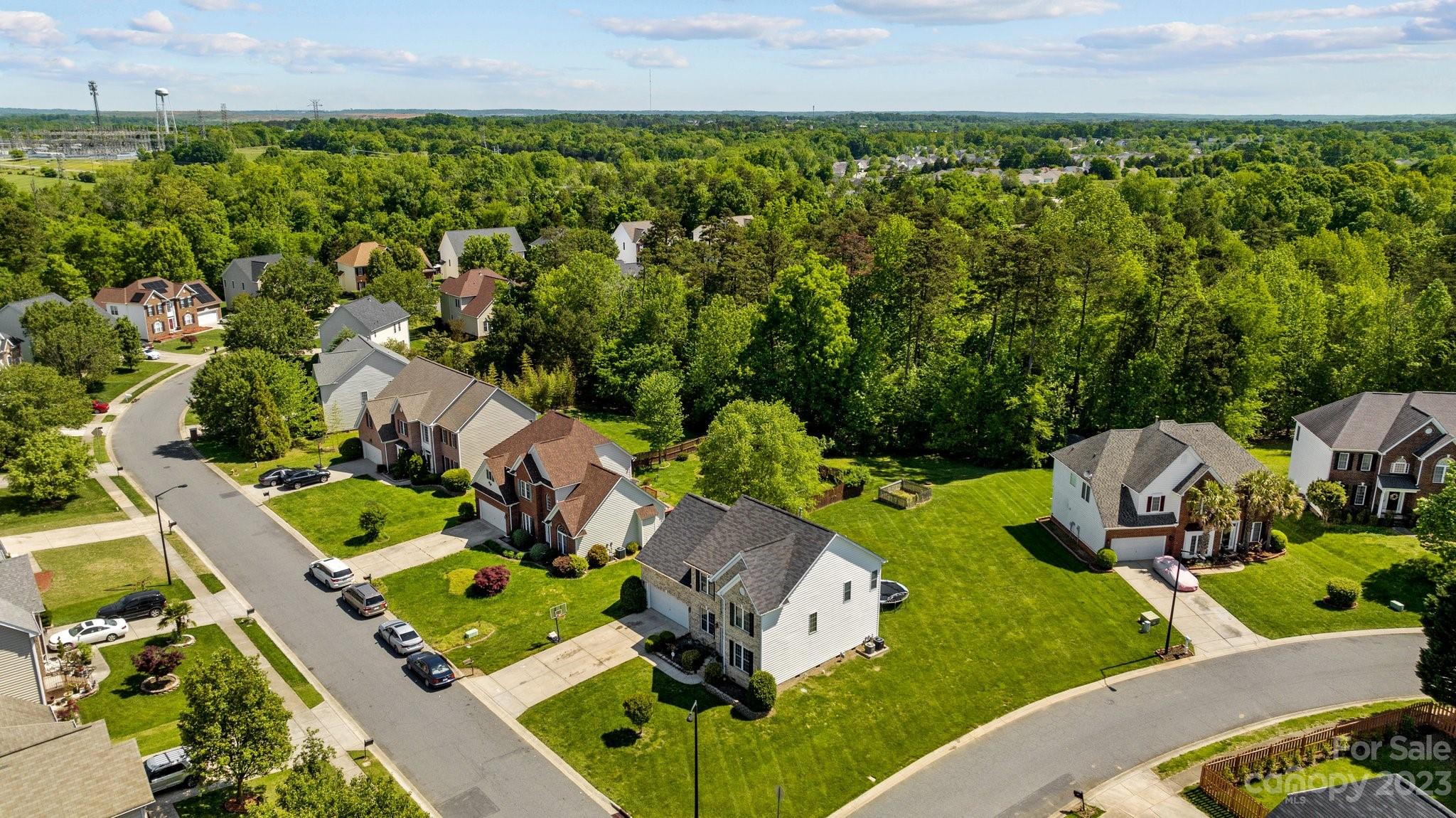 10834 Hellebore Road Charlotte, NC 28213 - Photo 39 of 41 an aerial view of a house with garden space and street view