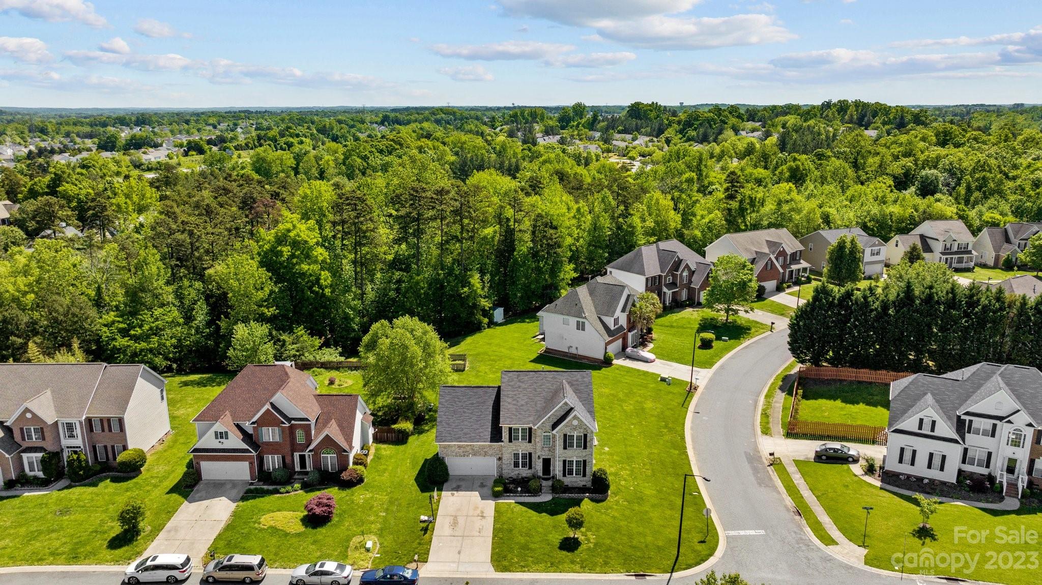 10834 Hellebore Road Charlotte, NC 28213 - Photo 40 of 41 an aerial view of a swimming pool patio and outdoor seating