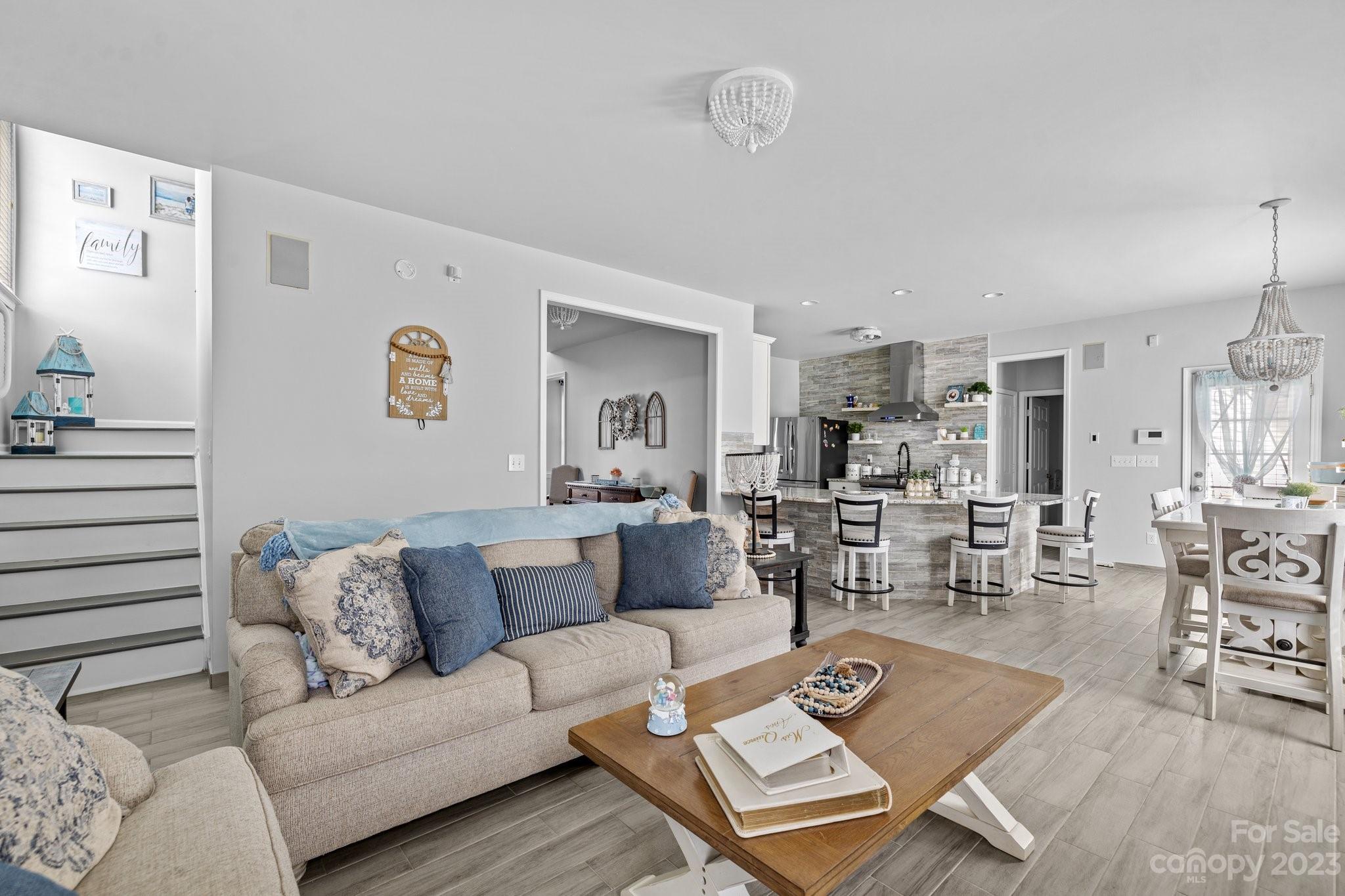 10834 Hellebore Road Charlotte, NC 28213 - Photo 6 of 41 a living room with furniture and wooden floor