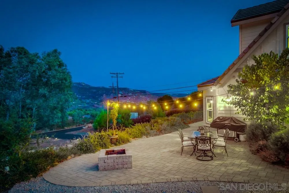 15410 Markar Road Poway, CA 92064 - Photo 6 of 61 a view of a patio with a table and chairs under an umbrella