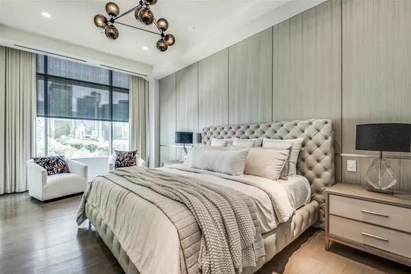 a bedroom with bed and large window