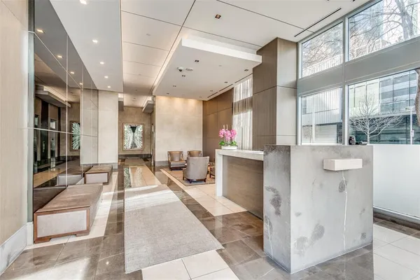 a lobby with furniture and a large window