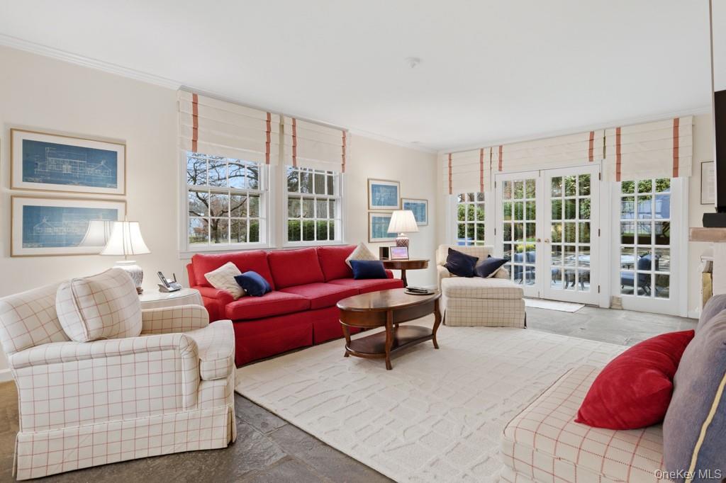 179 River Road Briarcliff Manor, NY 10510 - Photo 7 of 38 Family room featuring french doors to patio, and crown molding