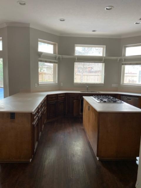 5710 Desert Oak Way Spring, TX 77379 - Photo 16 of 30 a kitchen with a sink stove and wooden cabinets