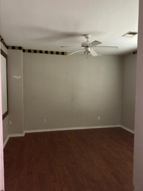 5710 Desert Oak Way Spring, TX 77379 - Photo 18 of 30 an empty room with a ceiling fan and kitchen view