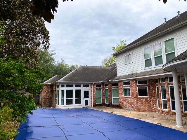 5710 Desert Oak Way Spring, TX 77379 - Photo 30 of 30 a view of a white house with large windows and a yard