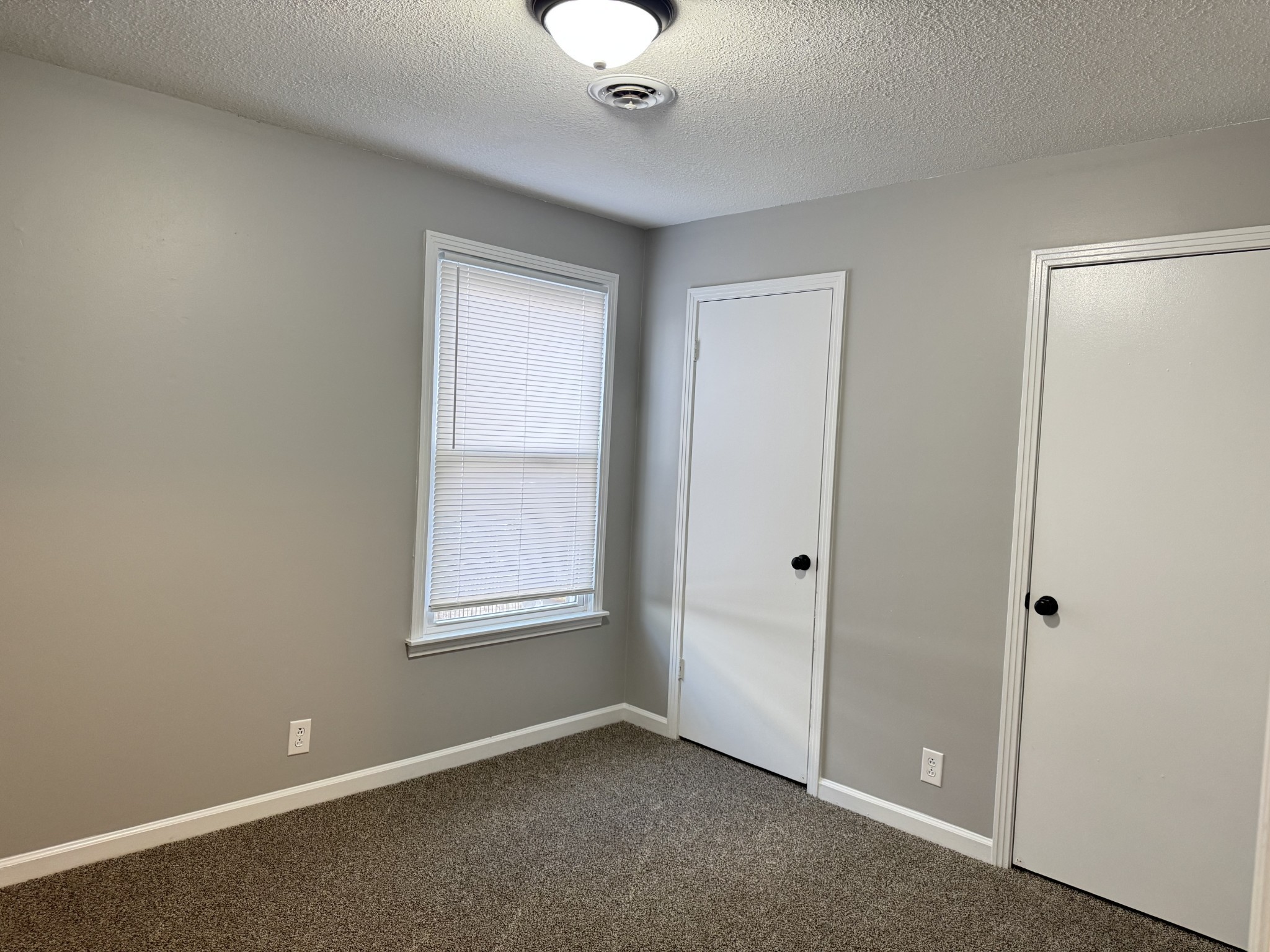528 Main Street, Unit 8 Clarksville, TN 37040 - Photo 12 of 12 an empty room with windows and closet