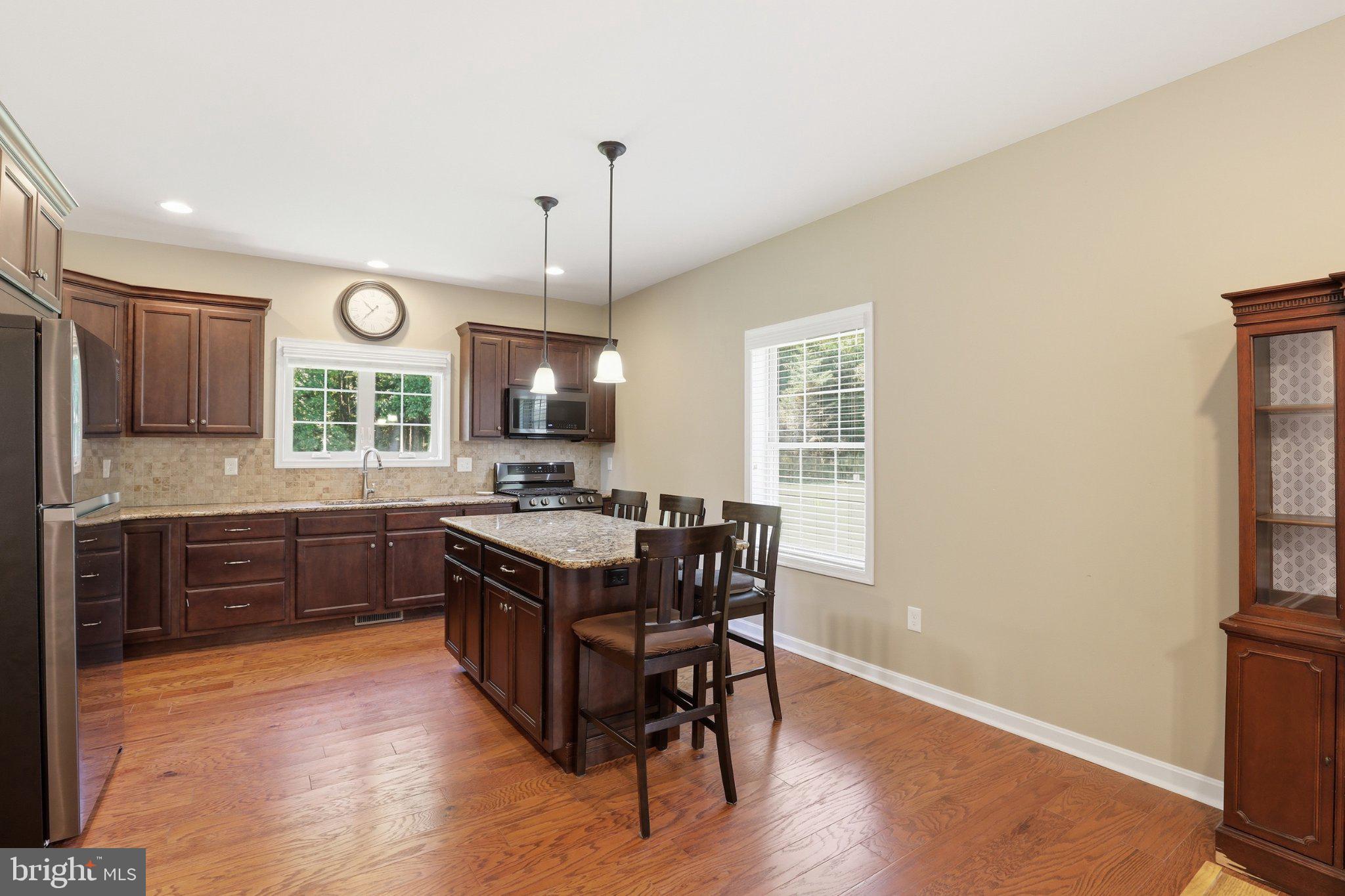 16932 Fitzgeralds Road Lincoln, DE 19960 - Photo 75 of 103 Modern kitchen with warm wood tones.