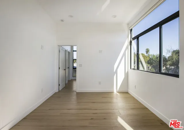 a view of an entryway with wooden floor