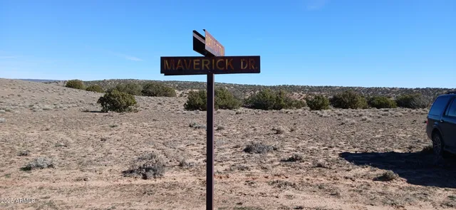 a view of ocean beach and mountain