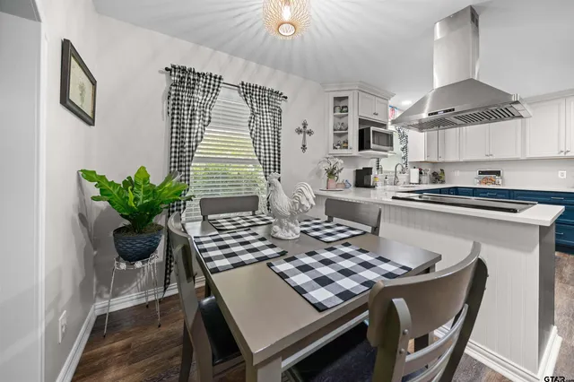 a kitchen with a stove a sink and a refrigerator