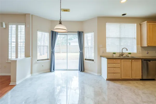 a large bathroom with a sink and a large mirror