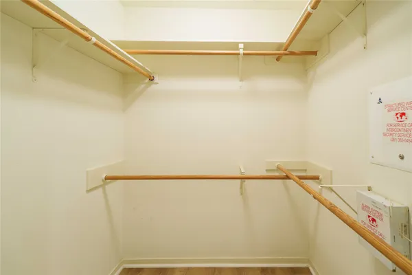 a view of hallway with wooden floor