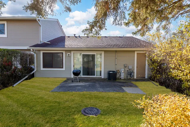 a view of a house with backyard and porch