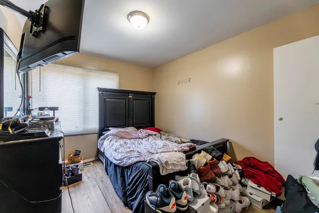 a bedroom with a bed and a dresser