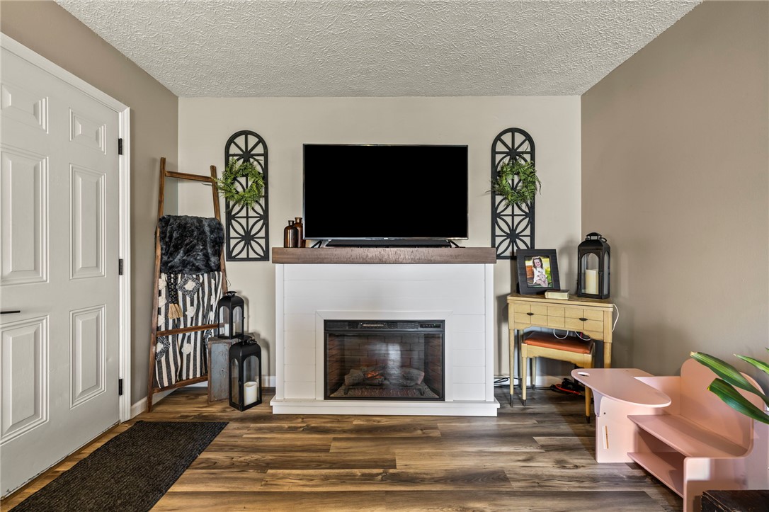 8969 Franklin-Trenton Road Franklin, OH 45005 - Photo 28 of 49 Warm and inviting living space with a focal fireplace and durable flooring.