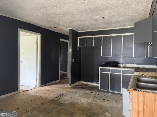 107 Benjamin Street Fort Valley, GA 31030 - Photo 2 of 26 a kitchen with kitchen island granite countertop a refrigerator and a sink