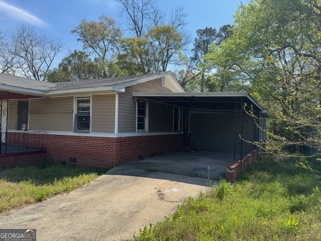 107 Benjamin Street Fort Valley, GA 31030 - Photo 23 of 26 a house with trees in the background