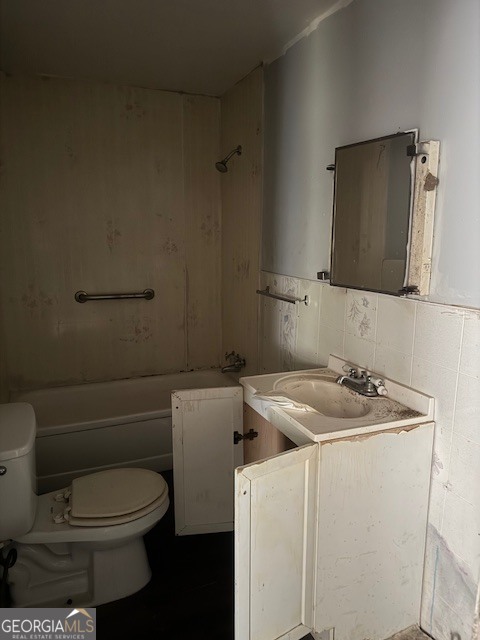 107 Benjamin Street Fort Valley, GA 31030 - Photo 9 of 26 a bathroom with a granite countertop sink toilet and mirror