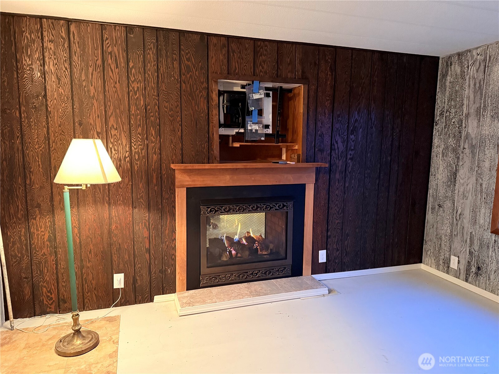 411 Southwest College Avenue Wilbur, WA 99185 - Photo 28 of 40 a living room with furniture and a fireplace