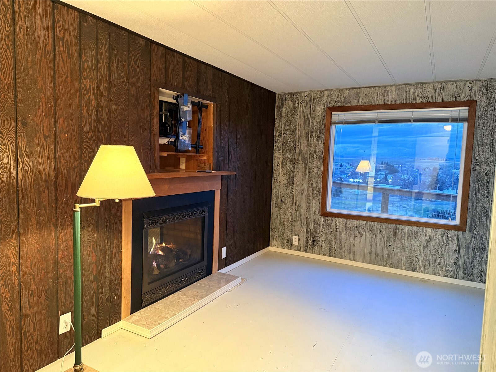 411 Southwest College Avenue Wilbur, WA 99185 - Photo 29 of 40 a bedroom with a bed and a fireplace