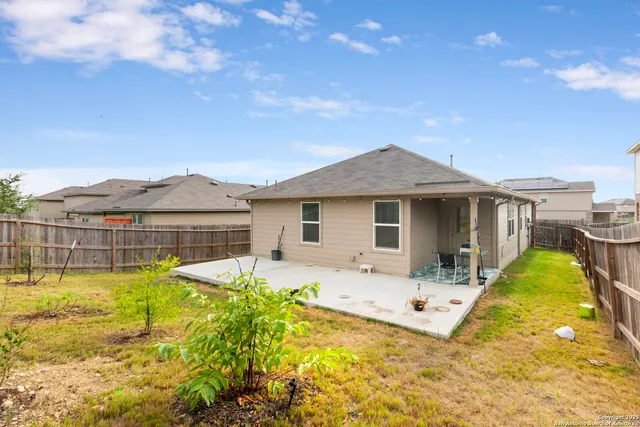a view of a house with swimming pool and a yard