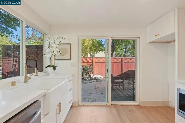 a bathroom with a double vanity sink and large mirror