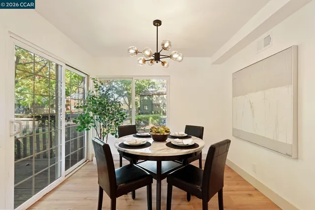 a view of a dining room with furniture window and outside view