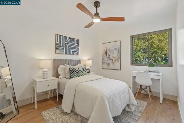 a bedroom with a large bed and a window