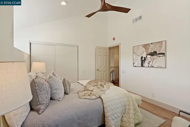 a bedroom with a bed and the view of bathroom