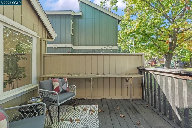 an outdoor space with furniture and umbrella
