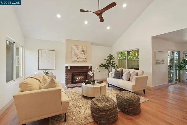 a living room with furniture and a fireplace