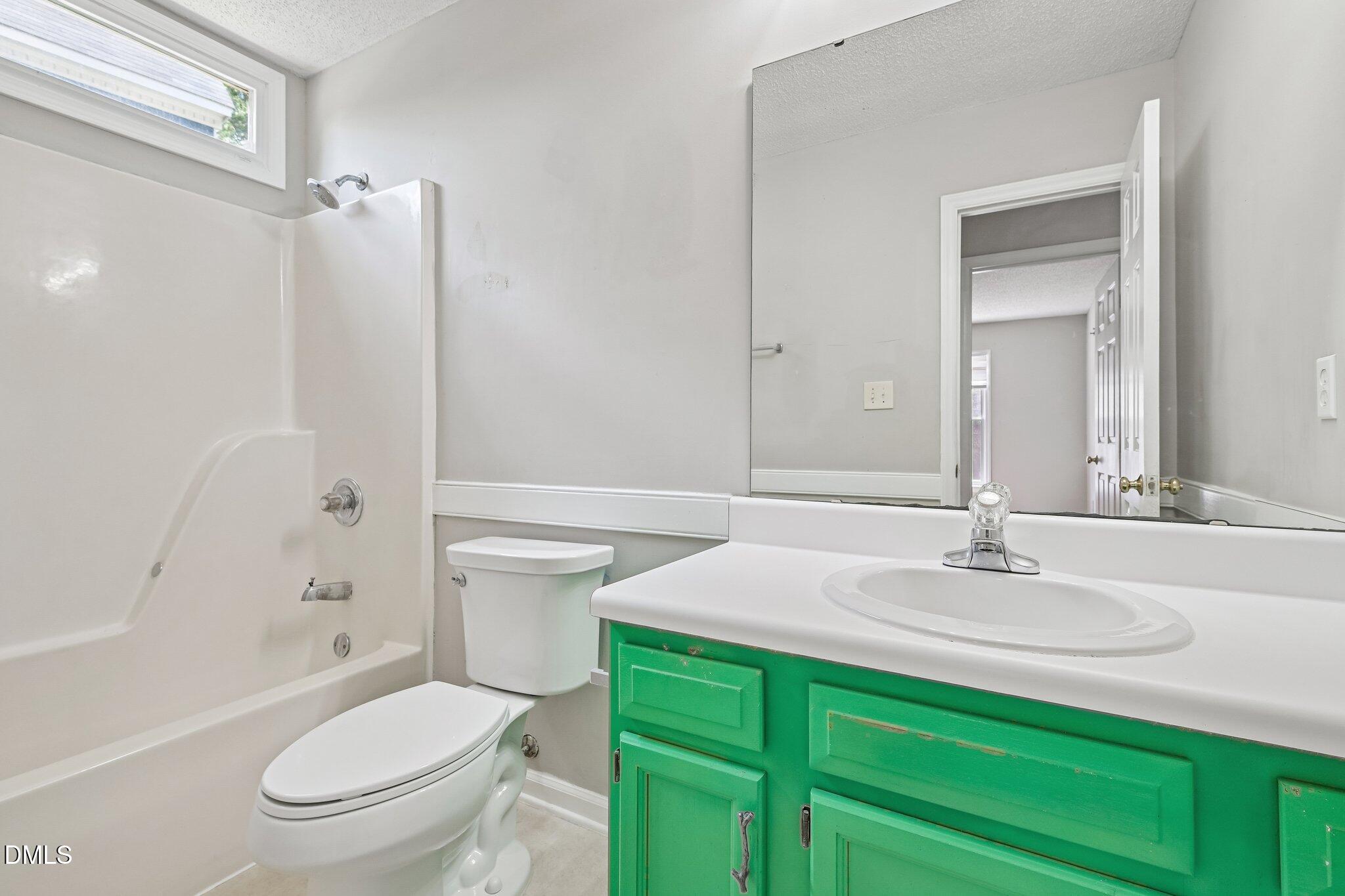 2800 West Jameson Road Raleigh, NC 27604 - Photo 20 of 24 a bathroom with a sink a toilet and shower