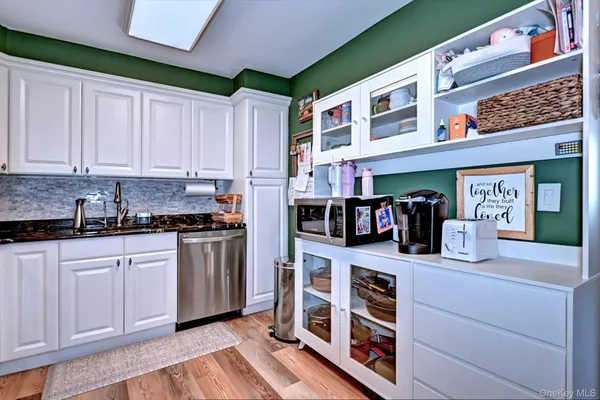 a kitchen with stainless steel appliances granite countertop a stove and a sink