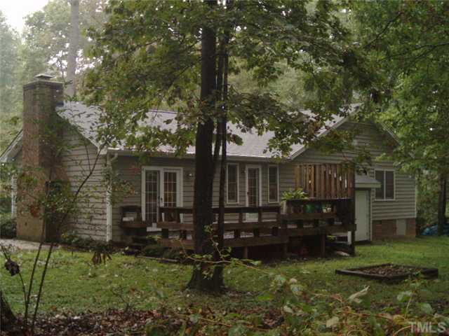 3833 Whispering Branch Road Raleigh, NC 27613 - Photo 3 of 12 a view of a house with backyard
