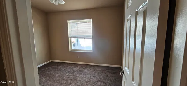 a view of empty room with windows