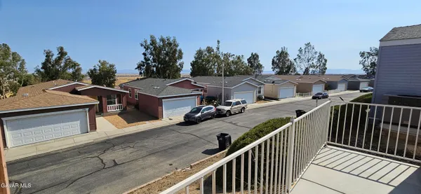 a view of a house with deck and outdoor space